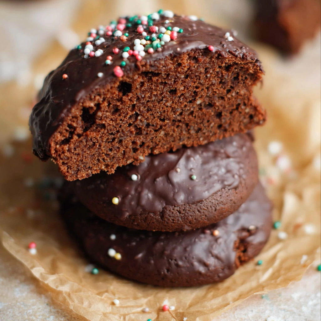 A stack of chocolate cookies with sprinkles.