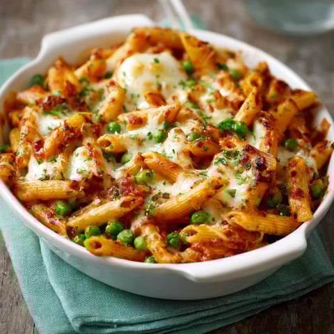 A bowl of pasta with peas and cheese.