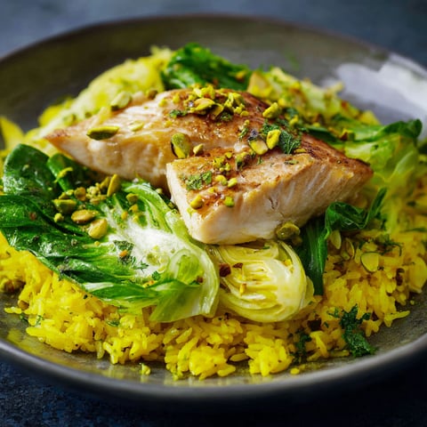 A plate of food with fish and vegetables.