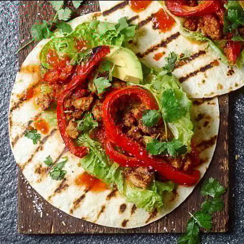 A grilled wrap with pepperoni and lettuce.