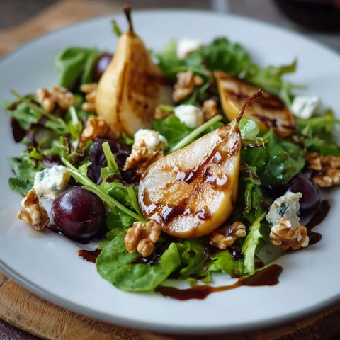 A plate of salad with a slice of apple and walnuts.