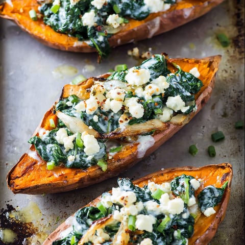 Sweet potatoes with spinach, feta and garlic cream.