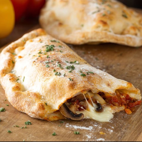 A calzone with mushrooms and cheese.