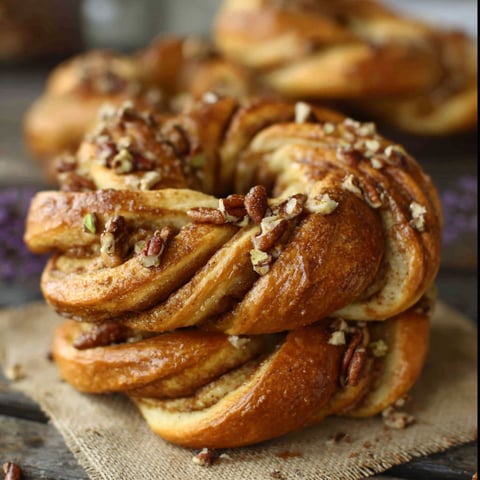 A stack of bread with nuts and cinnamon.
