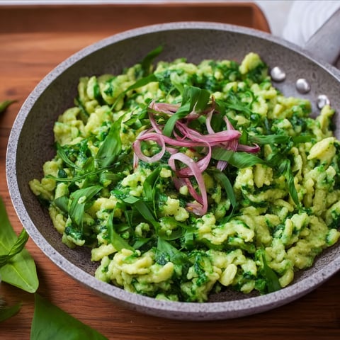 A bowl of Spätzle with vegetables.